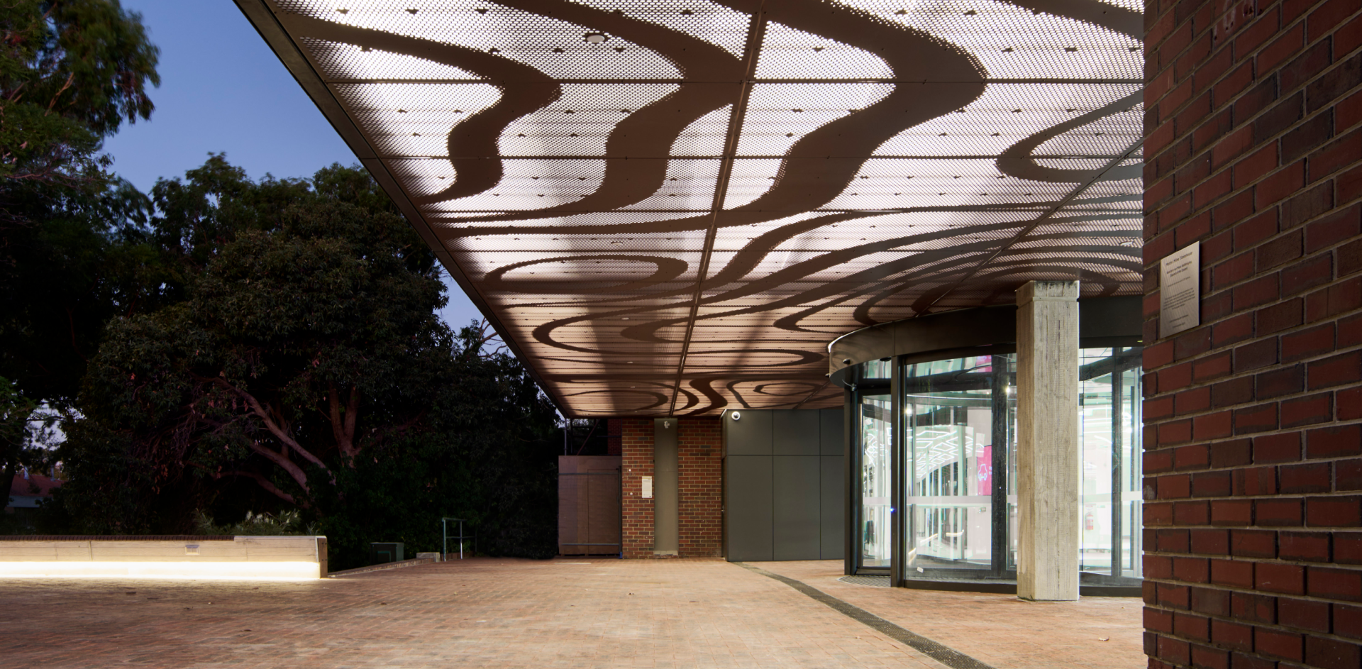 Exterior view of entrance to building in the evening