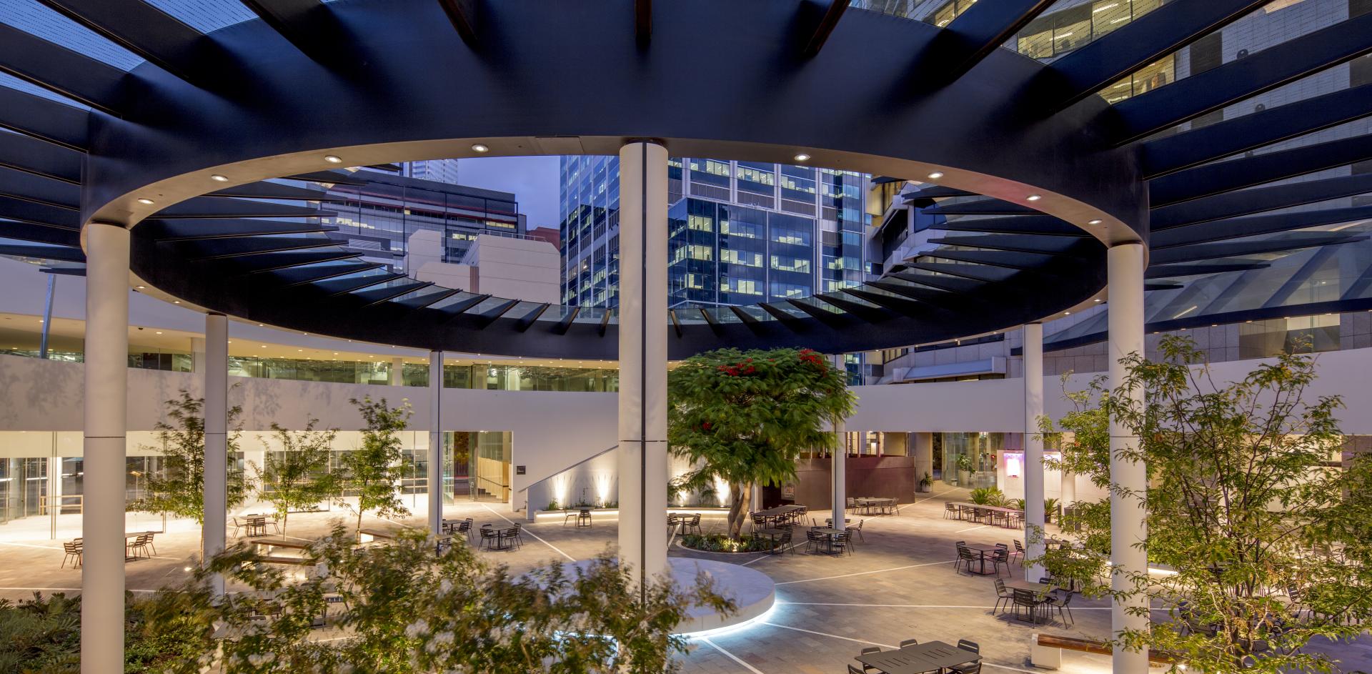 QV1 building with an architectural circular opening in the ceiling