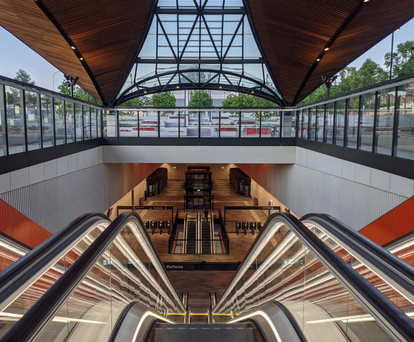 Inside Sydney Metro station in front of escalator
