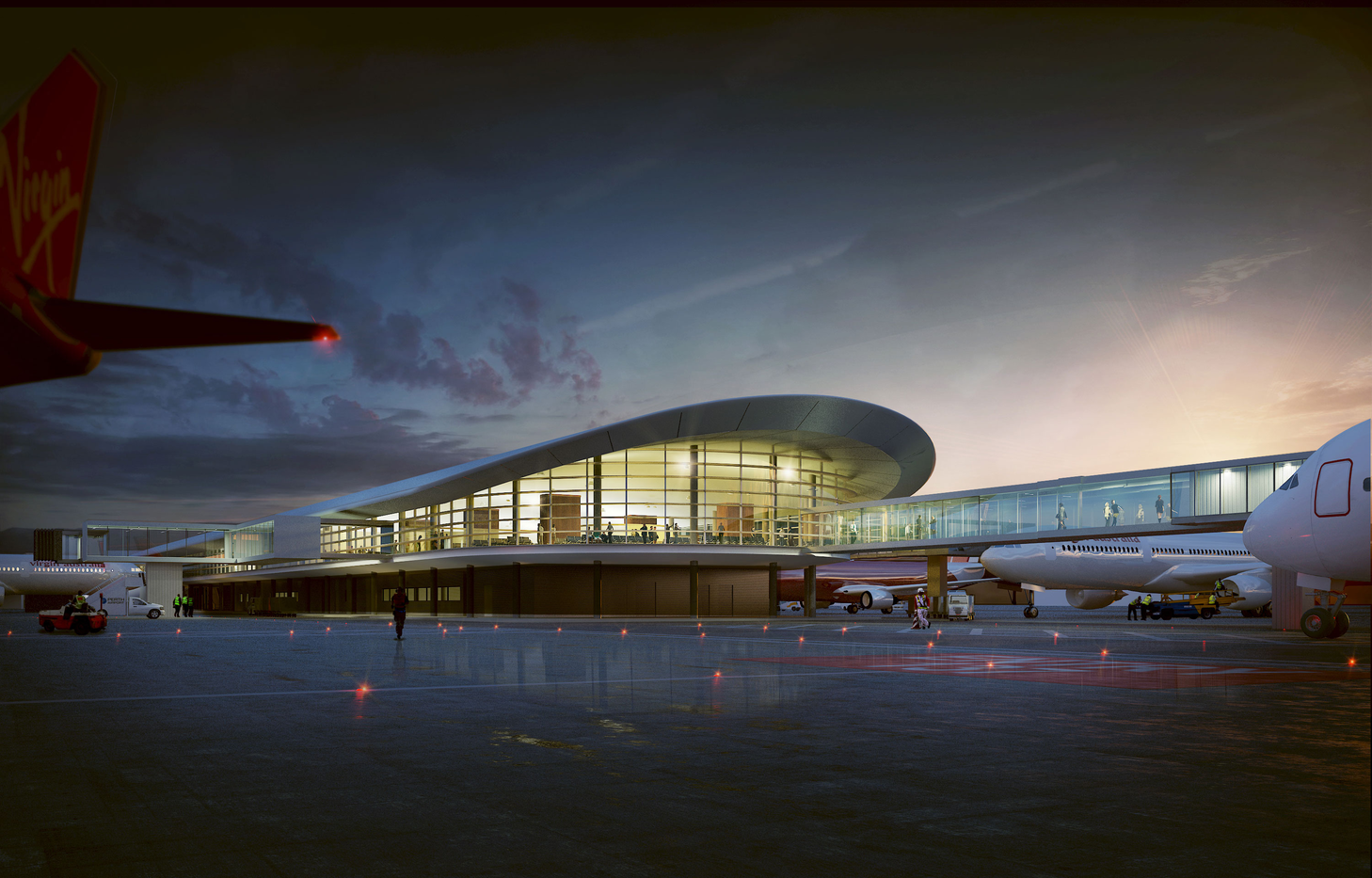 Airport terminal viewed from the runway at sunset