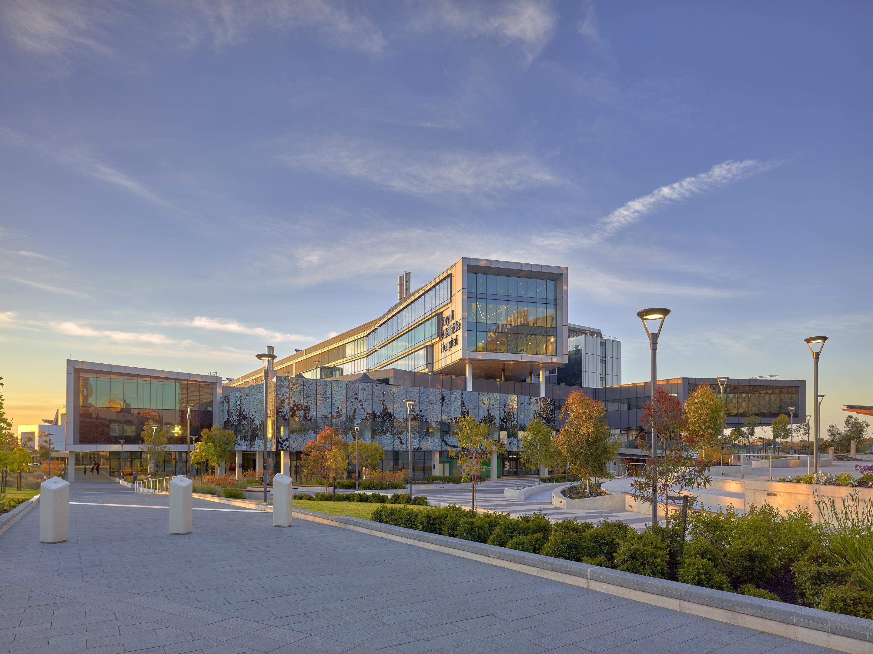 Front view of Royal Adelaide Hospital building and gardened seating and entrance area