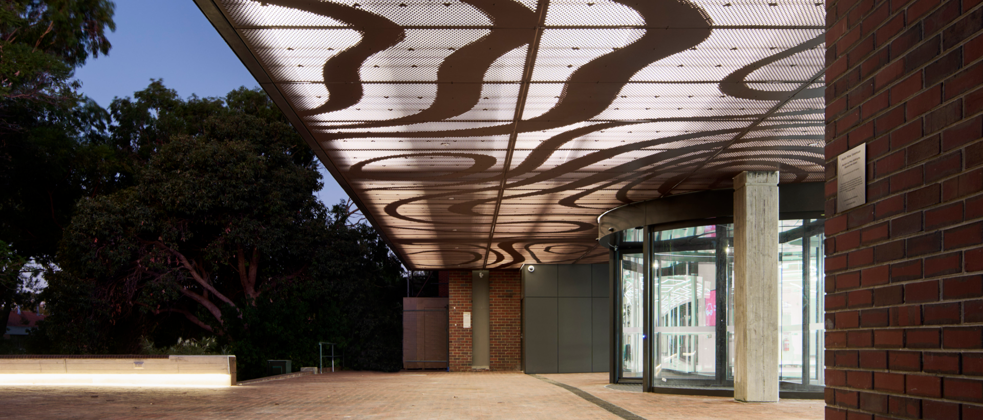 Exterior view of entrance to building in the evening