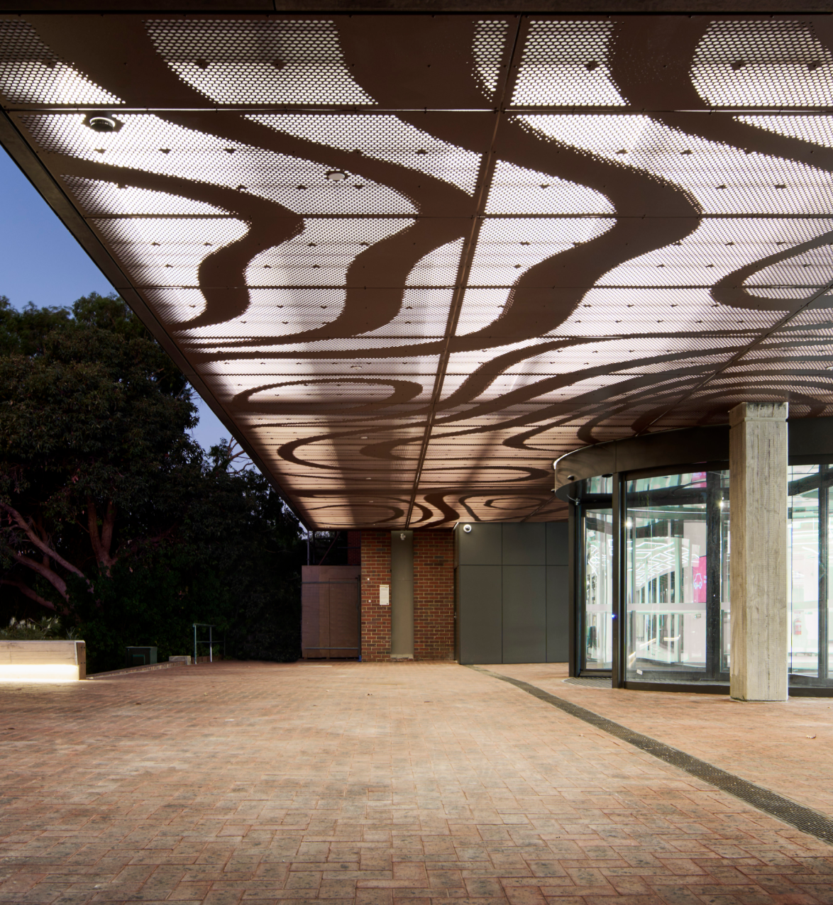 Exterior view of entrance to building in the evening