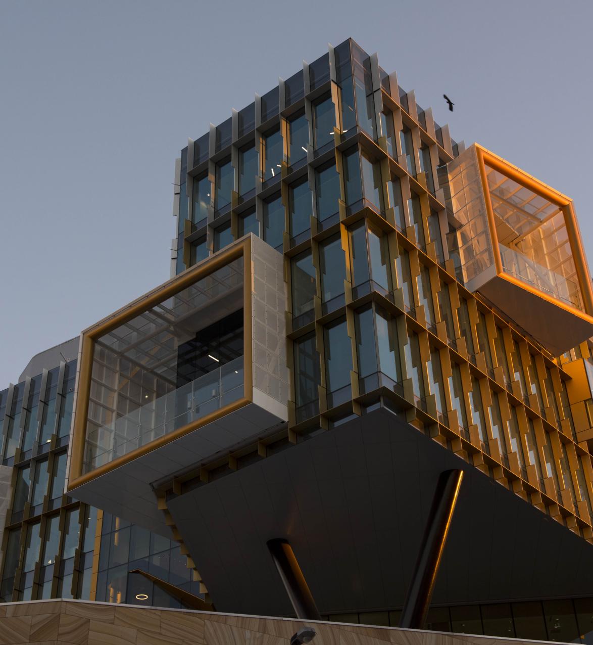 Exterior view of modern, square building with large glass windows