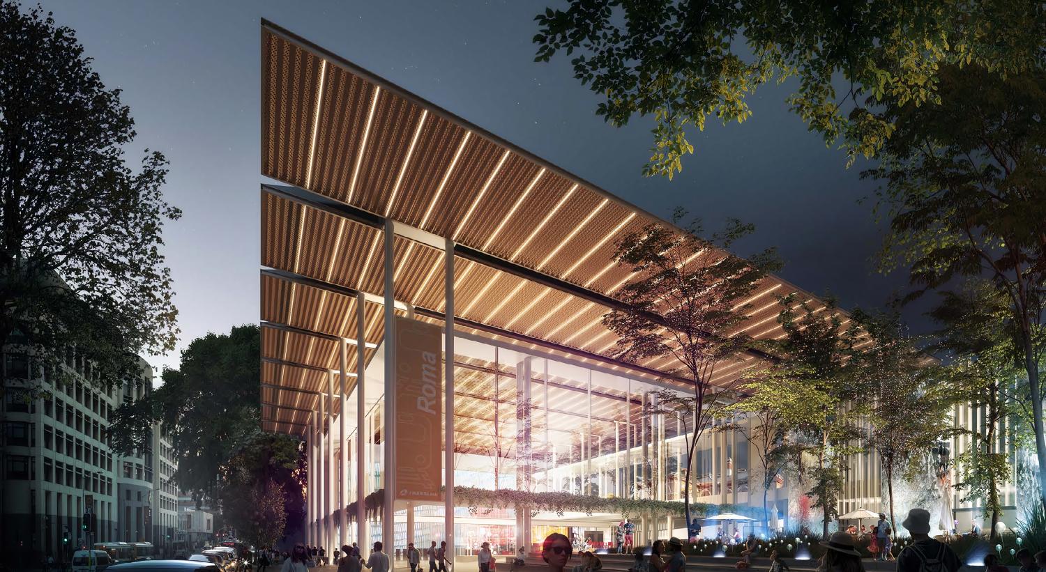 Artistic render of modern railway station lit up at night with people outside